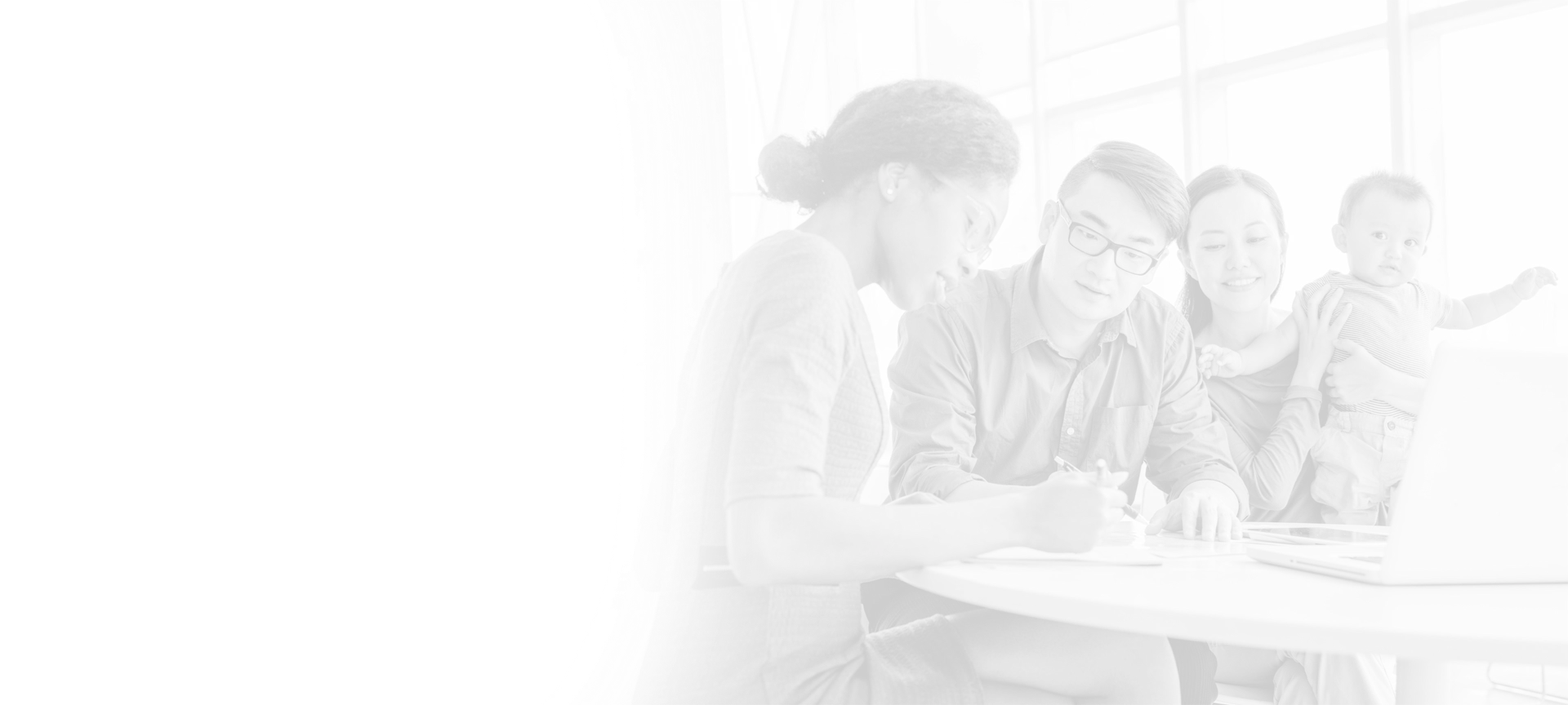 An associate meeting with a family to go over their finances