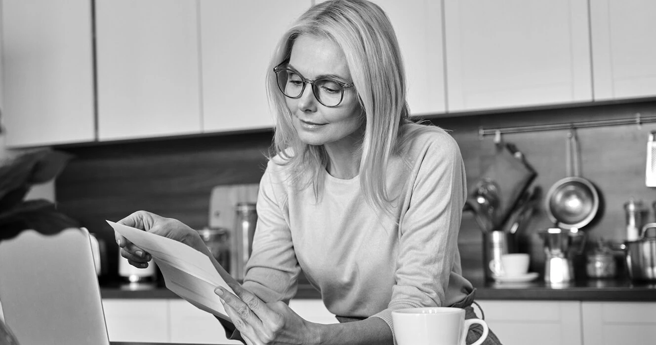 A woman reading her financial statement